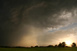 Das Gewitter mit Niederschlagskern und tiefstehender Sonne daneben - Standort bei Starnberg