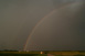 Durchgehender Regenbogen an der Rckseite der Gewitterzelle