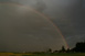 Durchgehender Regenbogen an der Rckseite der Gewitterzelle